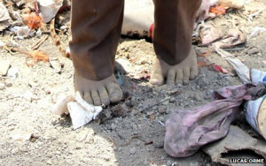 Barefoot boy in La Joya rubbish dump, Granada, Nicaragua