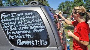 ... paints scripture verses on a car, Sept. 19, 2012 in Kountze, Texas