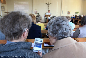 ... Tablet... Church uses WiFi and computers to stream prayers and hymns