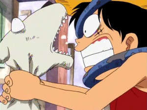 Luffy strangles Chouchou after he swallows the key to his cage.