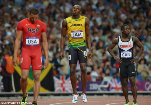 ... Usain Bolt (C) prepares next to US' Ryan Bailey (L) before competing