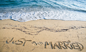 Just Married written in the Sand - Stock Image