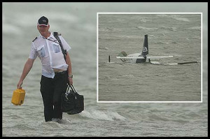 ... out of the water after safely ditching his plane in Darwin Harbour