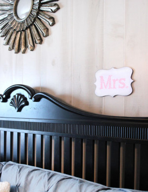 mr and mrs wood cut out above bed