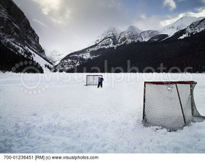 Child on Outdoor Hockey Rink, Lake Louise, Alberta, Canada