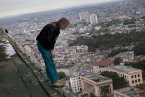 Alain Robert known as “Spiderman”, looks over the edge from the ...