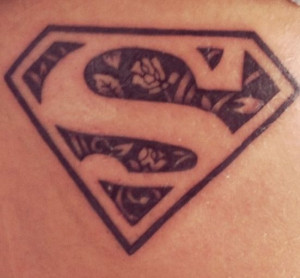 Superman tattoo with roses