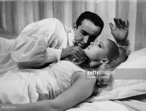 News Photo Actors Vittorio Gassman and Virna Lisi lying in