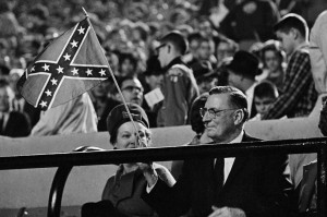 Mississippi Gov. Ross Barnett waves a confederate flag before the ...