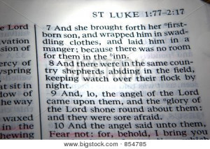 ... of the birth of Jesus Christ. A beam of light highlights the verses