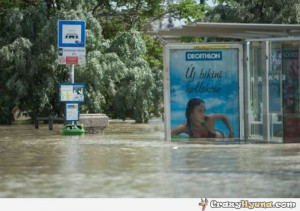 funny-swimming-ad-at-a-flooded-bus-stop