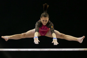 Iordache performs on uneven bars during the 6th Doha Art Gymnastics ...
