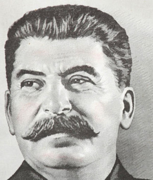 communist supporter holds a portrait of the Soviet dictator Josef ...