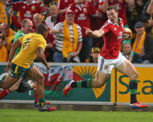 gestures to Australia's Will Genia on his way to a try, Australia ...