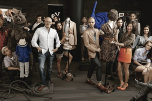 Mickey Drexler (standing left, in jeans), the C.E.O. of J. Crew, with ...