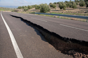 Asphalt road with a crack caused by landslides, Ja n, autonomous ...