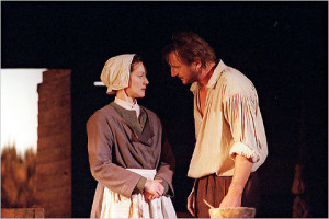 Liam Neesan as John Proctor and Laura Linney as his wife Elizabeth on ...