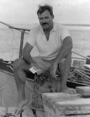 EH06670P Ernest Hemingway sitting on dock next to his boat, Pilar ...