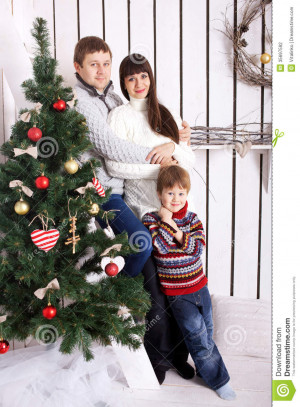 Funny family near the Christmas tree. Christmas, New Year, holiday ...