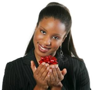 Beautiful, smiling black woman holds a small red package with a big ...