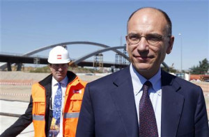 Italian Prime Minister Enrico Letta arrives at the construction site ...