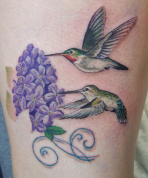 Realistic hummingbird tattoos.