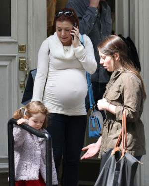 Alyson Hannigan 's belly is getting quote bulbous. The red headed ...