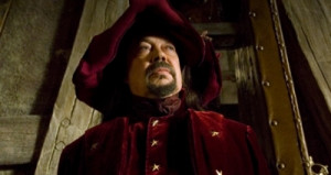 Tim Curry as Trymon, the power-hungry senior wizard at the Unseen ...