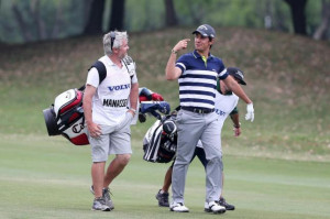 Italy's Matteo Manassero (R) talks with his caddy on the second day of ...