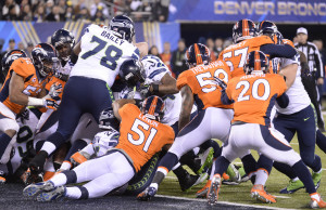 Marshawn Lynch (#24) of the Seattle Seahawks scores a 1-yard touchdown ...