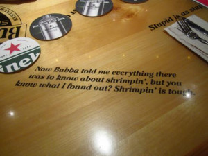 Bubba Gump Shrimp Company: Tables are covered in movie quotes.