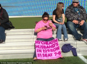 Fed up: A woman attending Wrestlemania 29 in New Jersey last Sunday ...