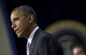 President Barack Obama pauses as he speaks about the new health care ...