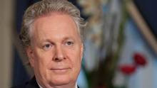 Quebec Premier Jean Charest watches during a ceremony where Lafontaine ...