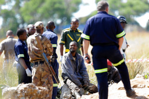 Dozens of men in an abandoned gold mine near Johannesburg refused to ...