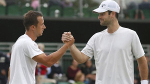 Brian Baker (right) shakes hands with Philipp Kohlschreiber