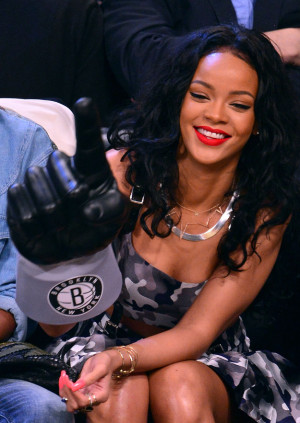 Rihanna Has Too Much Fun With A Giant Finger At a Basketball Game