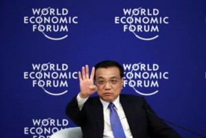 Chinese Premier Li Keqiang gestures as he speaks during a session of ...