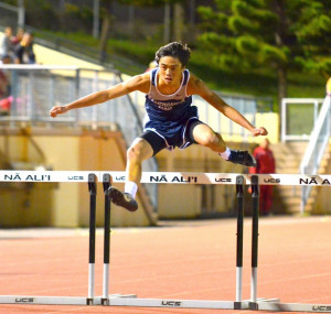 ... form in the junior varsity boys 300 hurdles. Photo by Rodney S. Yap