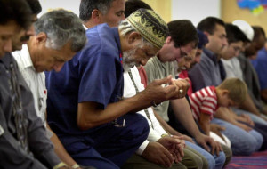 Bill Phares reads his Bible during a prayer service at Wesley United