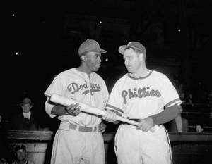 Robinson talks with Phillies manager Ben Chapman before playing at ...