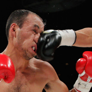 Christian Esquivel of Mexico receives a punch from Shinsuke Yamanaka ...