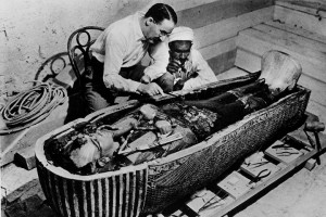 Howard Carter examines the coffin of Tutankhamun. Photo by Getty ...
