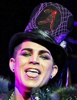 ... huge and sparkling in antique script on a top hat. In scarlet. Get it