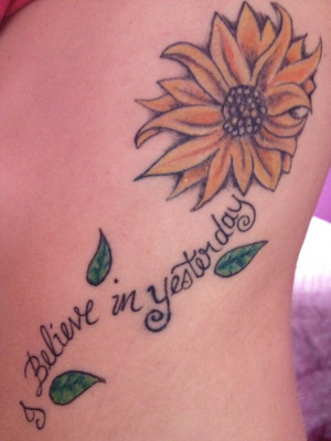 Sunflower tattoo. Stem made from words. would be nice to say 