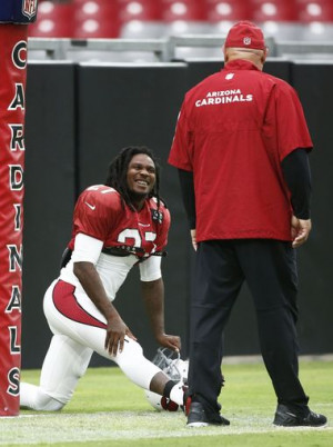 head coach Bruce Arians talks with his new running back Chris Johnson ...