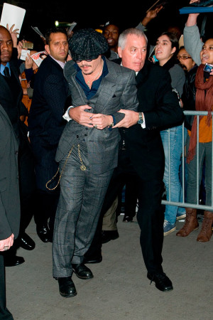 Johnny Depp restrained by his bodyguard - Celebrity Photos ...