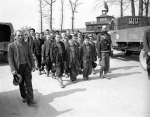Liberated orphans march out of the main gate of the Buchenwald camp