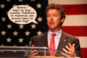 image of Rand Paul speaking in front of a giant US flag, to which I ...