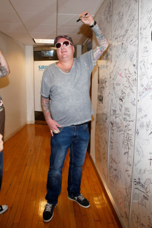 Eric Wilson Eric Wilson of Sublime with Rome signs the wall at